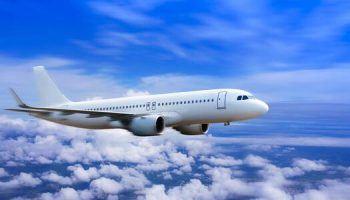 plane-in-the-sky-passenger-commercial-plane-flying-above-the-clouds-concept-of-fast-travel-vacation-and-business-photo